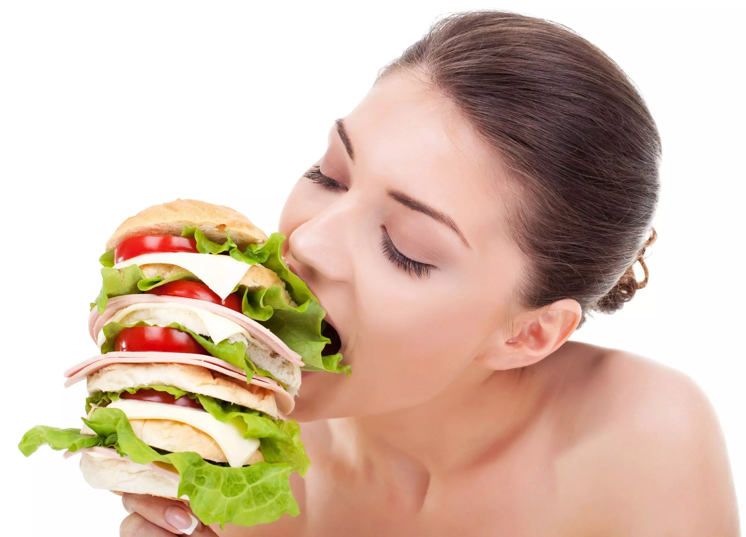 hungry woman eating huge burger