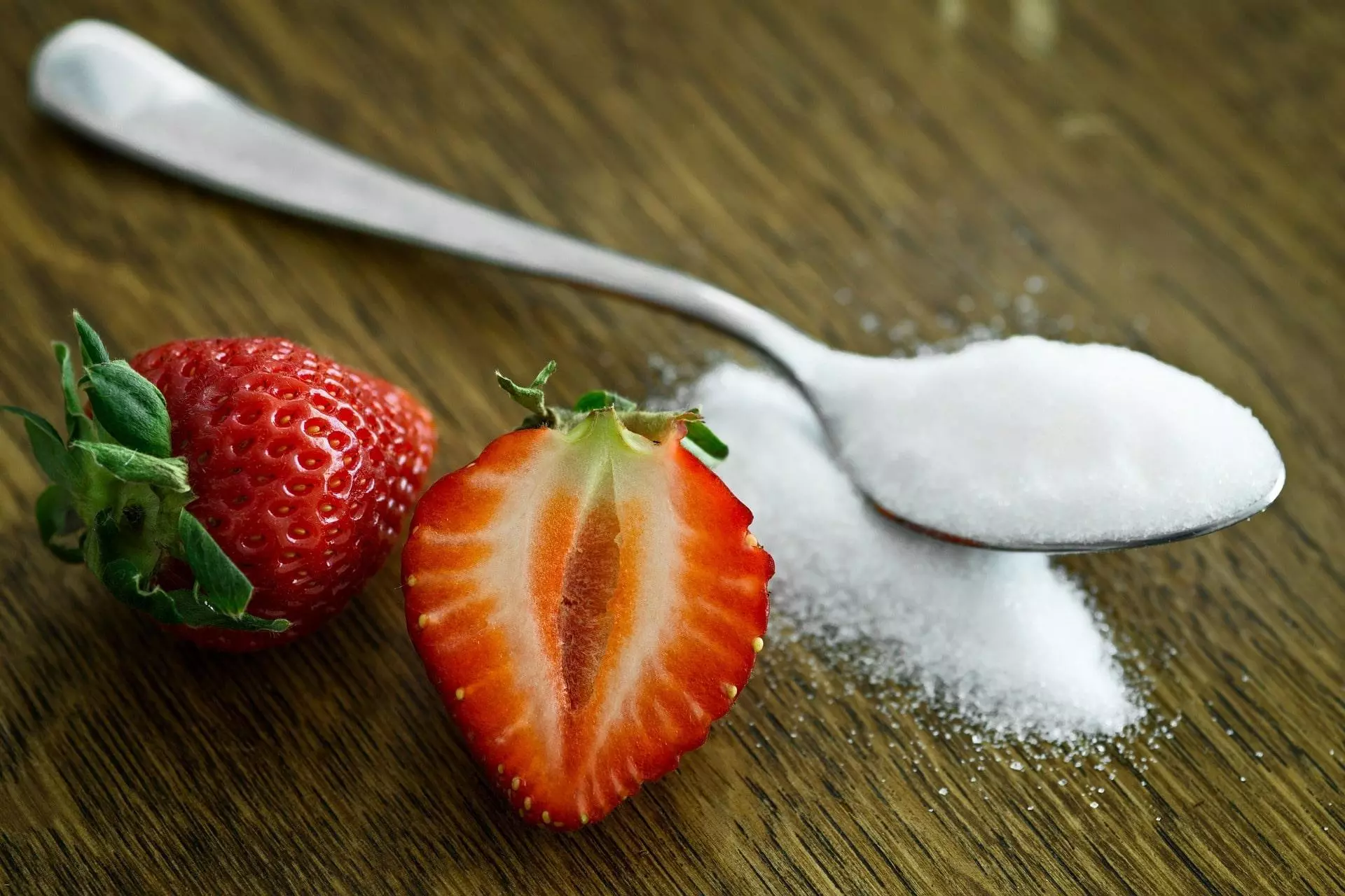 strawberry and spoon of sugar