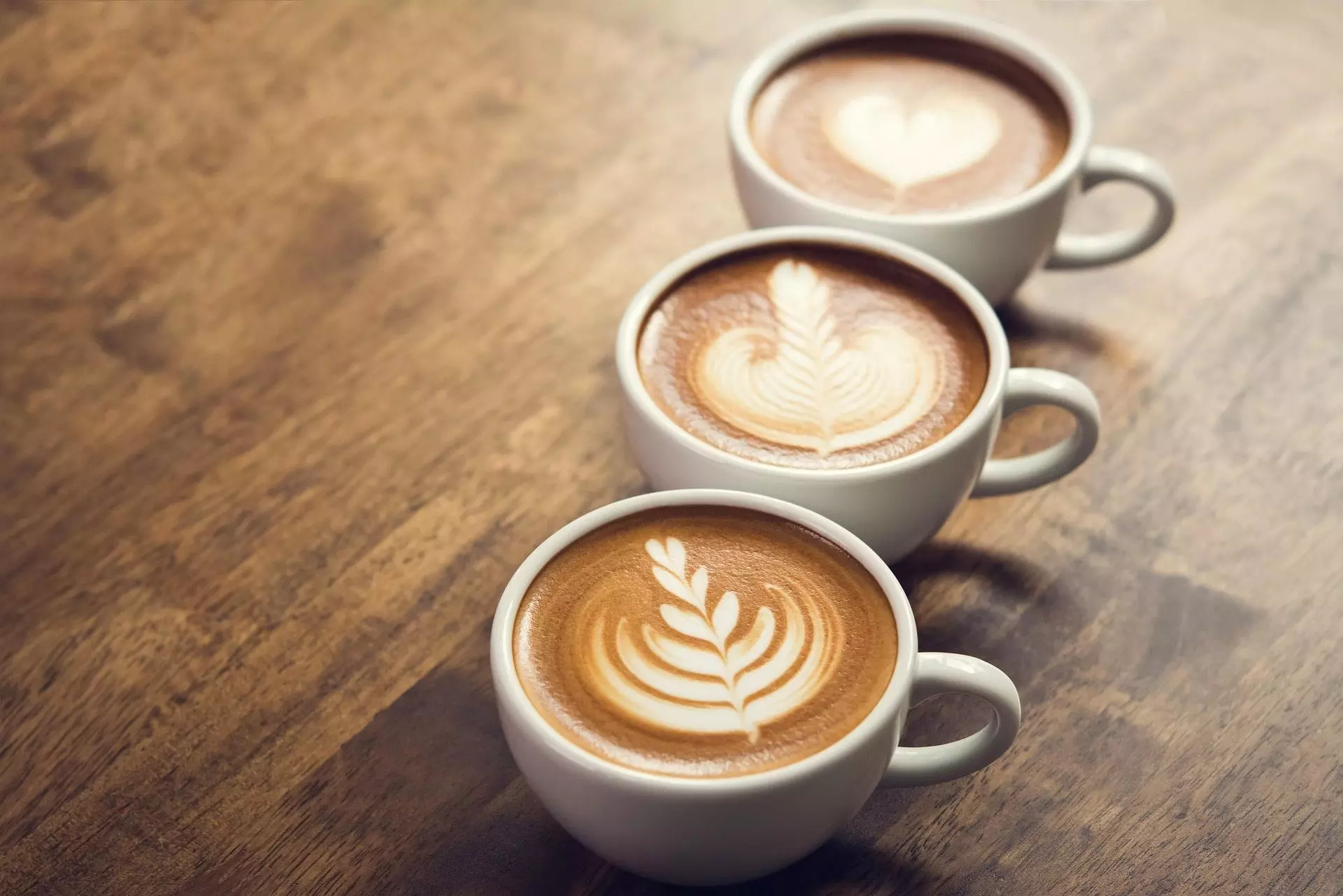 three coffee cups on a table