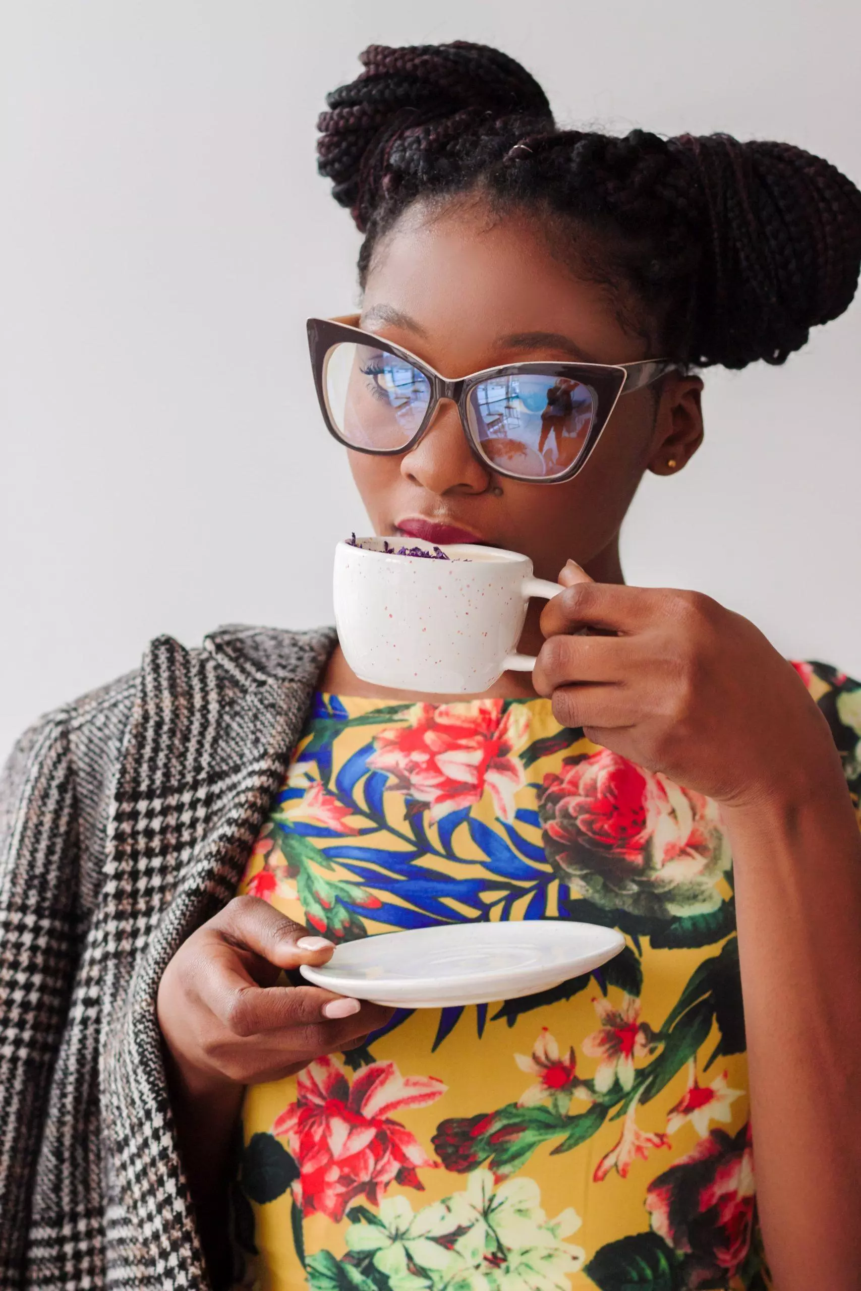 woman drinking from coffee cup