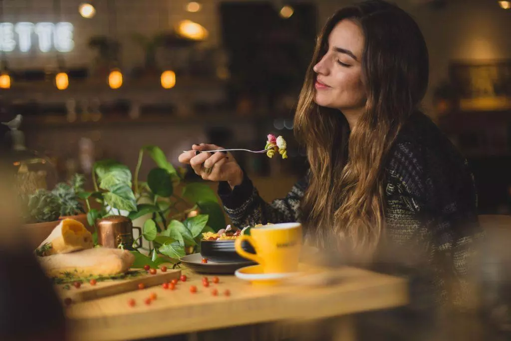 woman eating happily