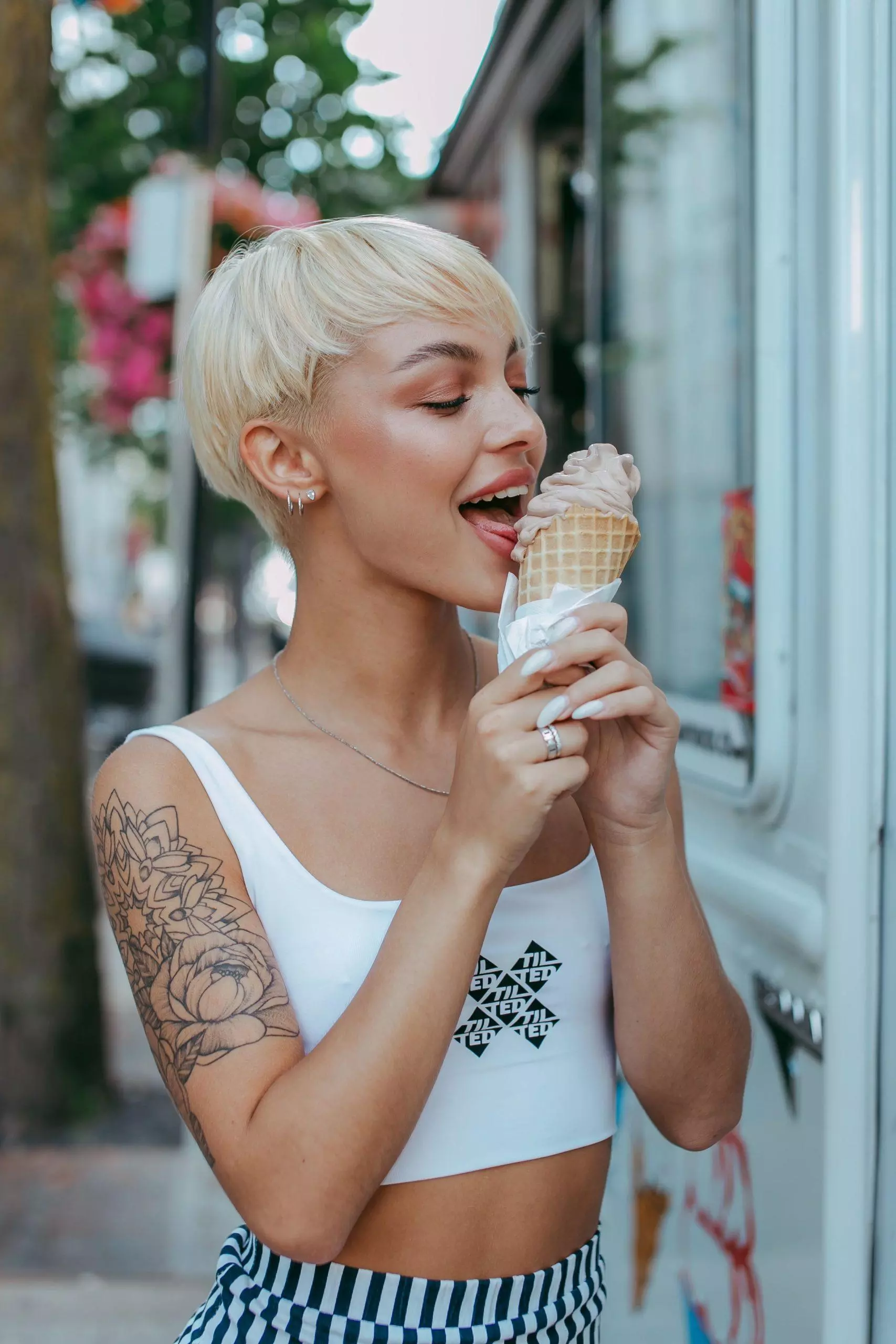 smiling woman eating ice cream