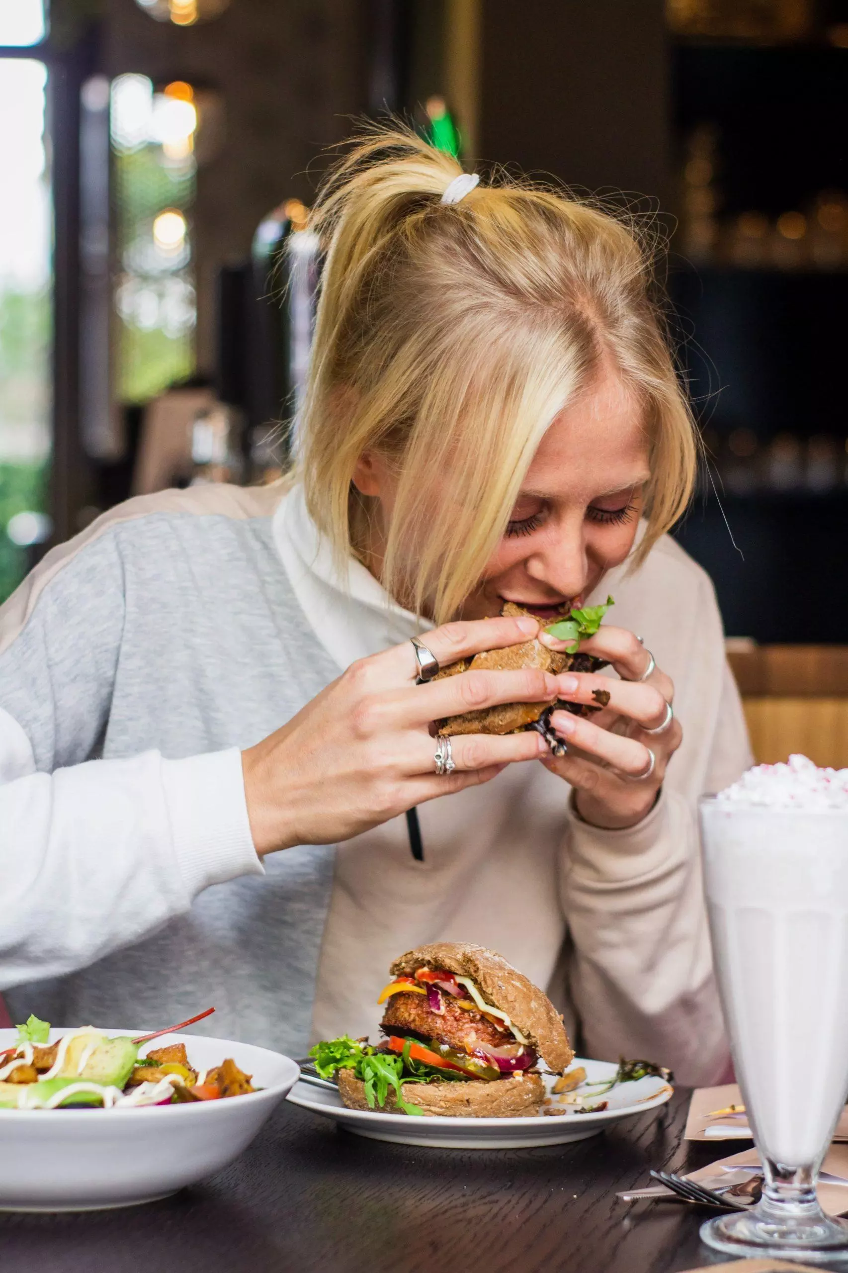 woman eating a hamburger