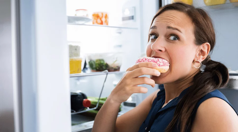 woman eating a donut